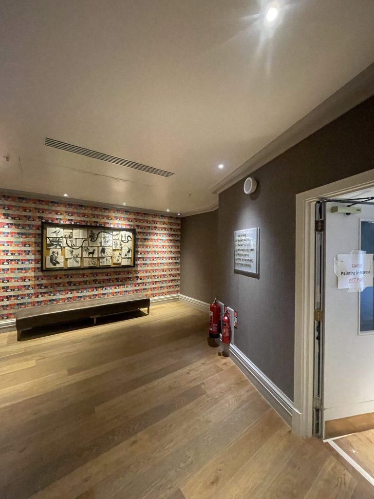 Hallway with decorative wall art